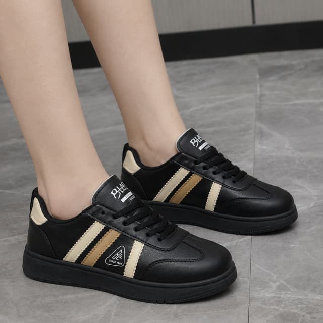 Luxurious Women’s Premium Leather Sneakers – Black & Gold Stripe Edition