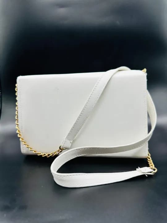 white coloured strap bag 2