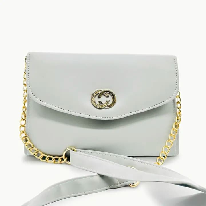 white coloured strap bag