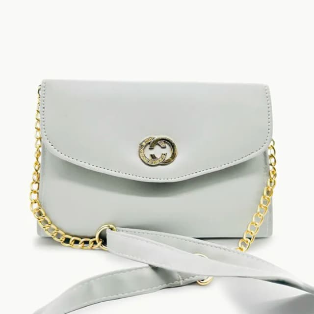 white coloured strap bag